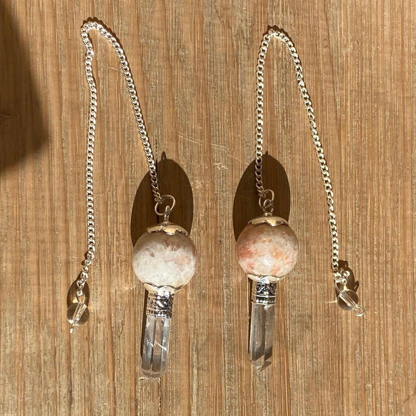 Sun stone pendulum with quartz point