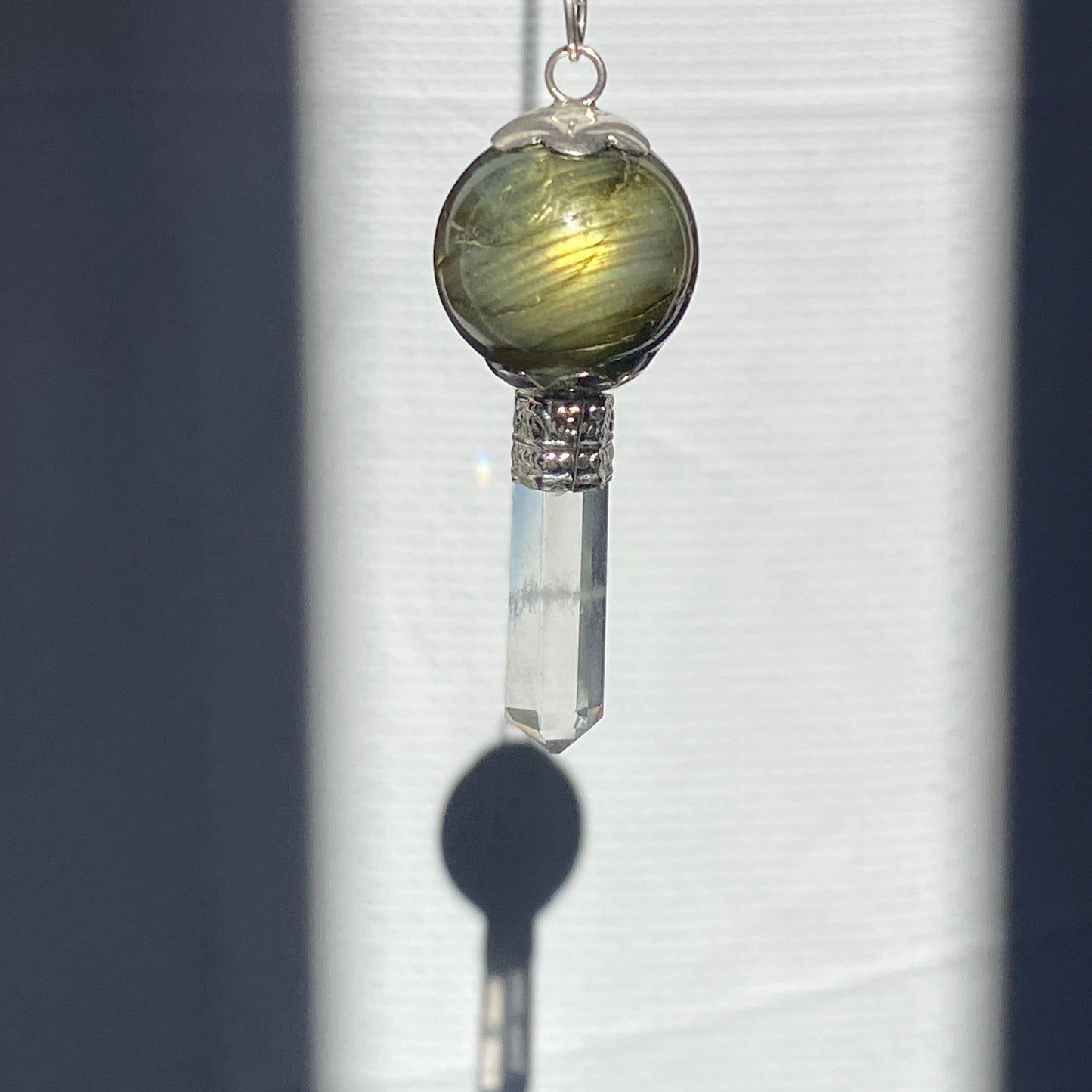 Labradorite pendulum with quartz point