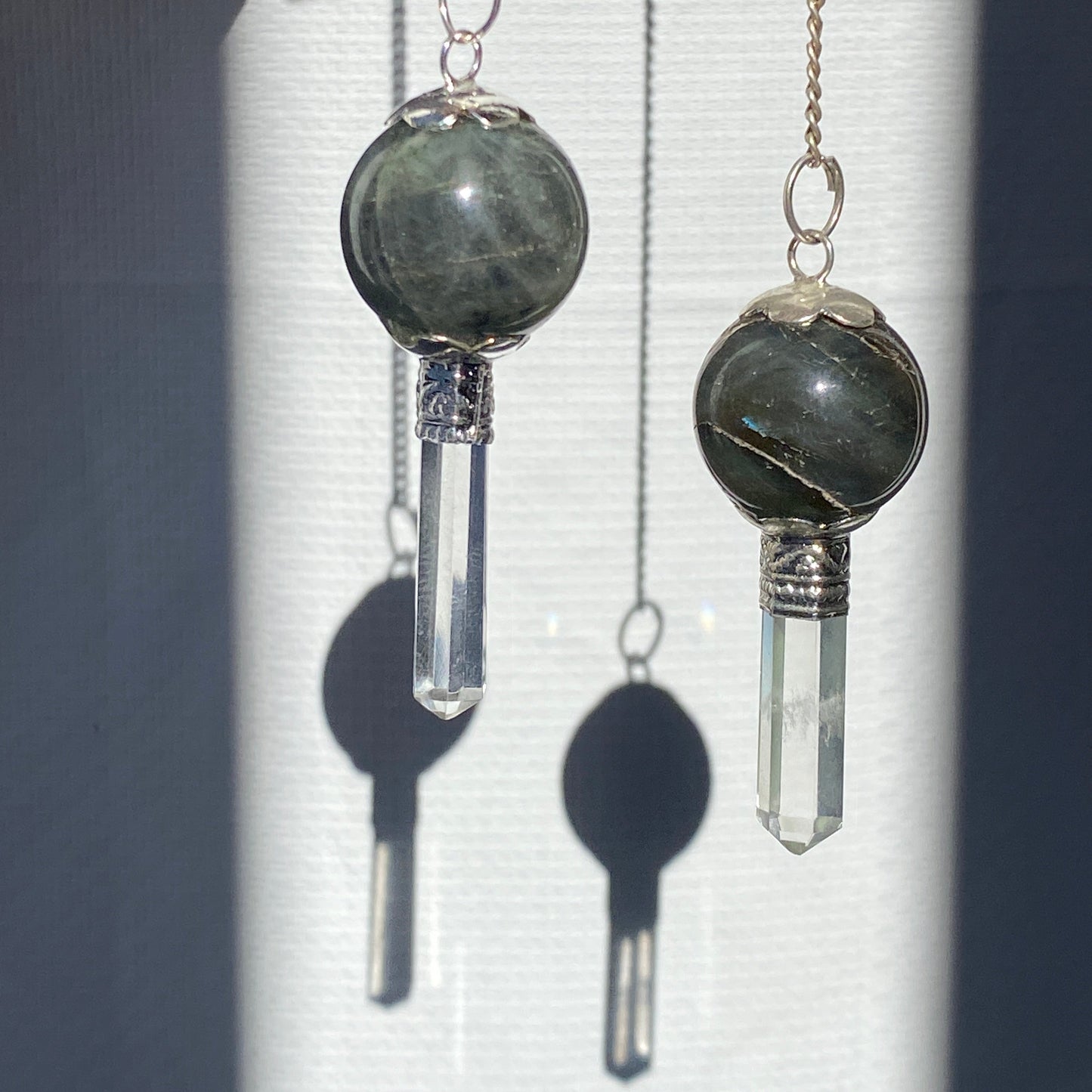 Labradorite pendulum with quartz point