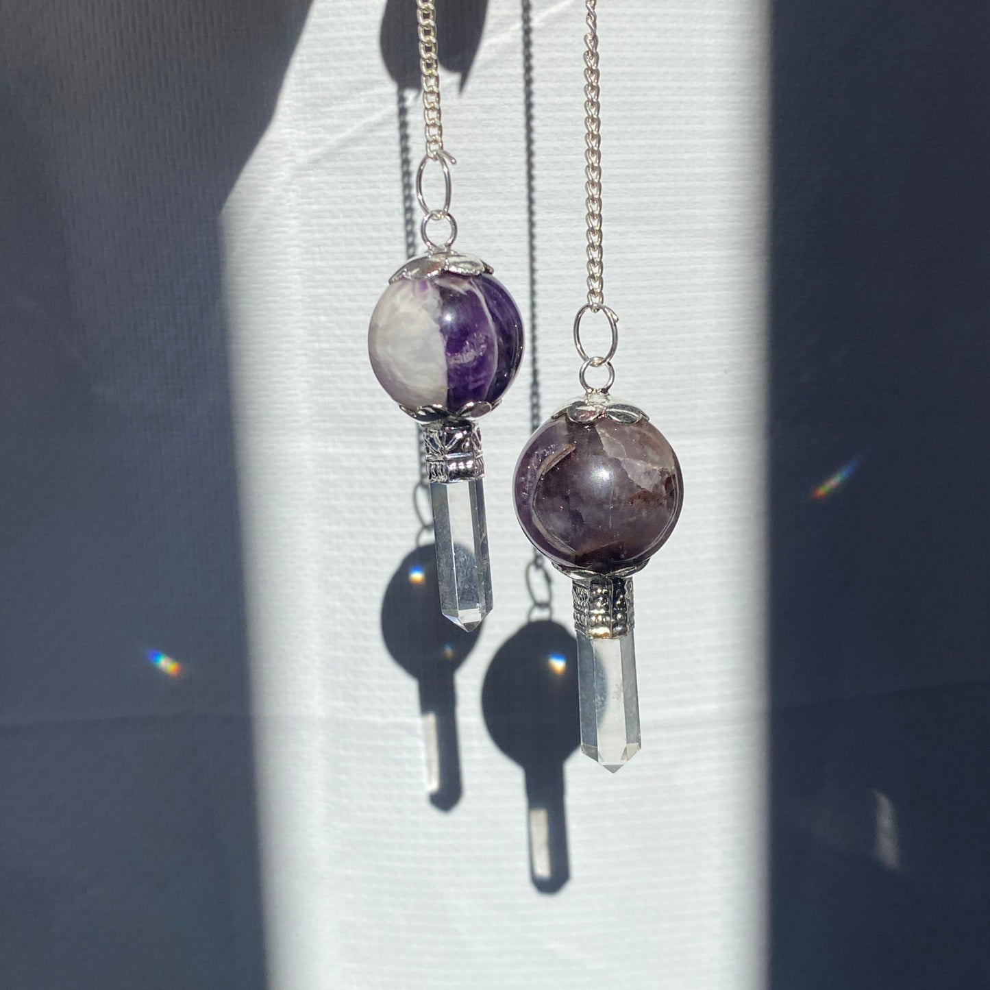 Amethyst pendulum with quartz point