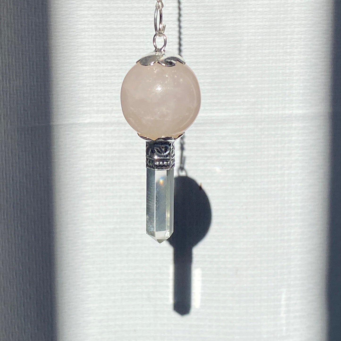 Rose Quartz pendulum with quartz point