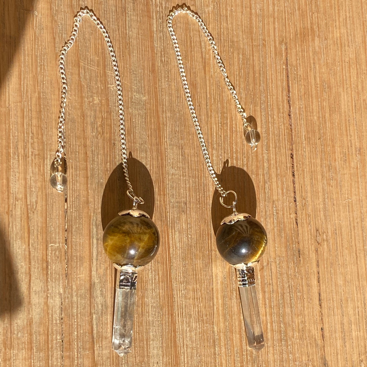 Tiger Eye pendulum with quartz point
