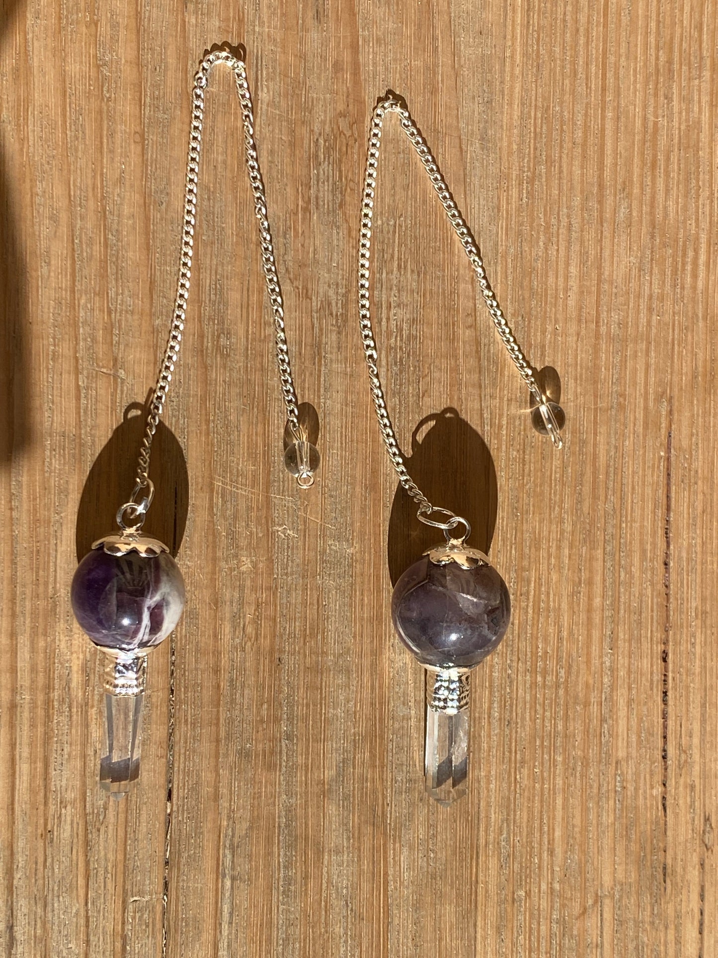 Amethyst pendulum with quartz point
