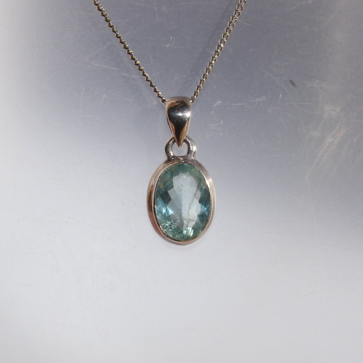 Aqua marine faceted pendant set in sterling silver