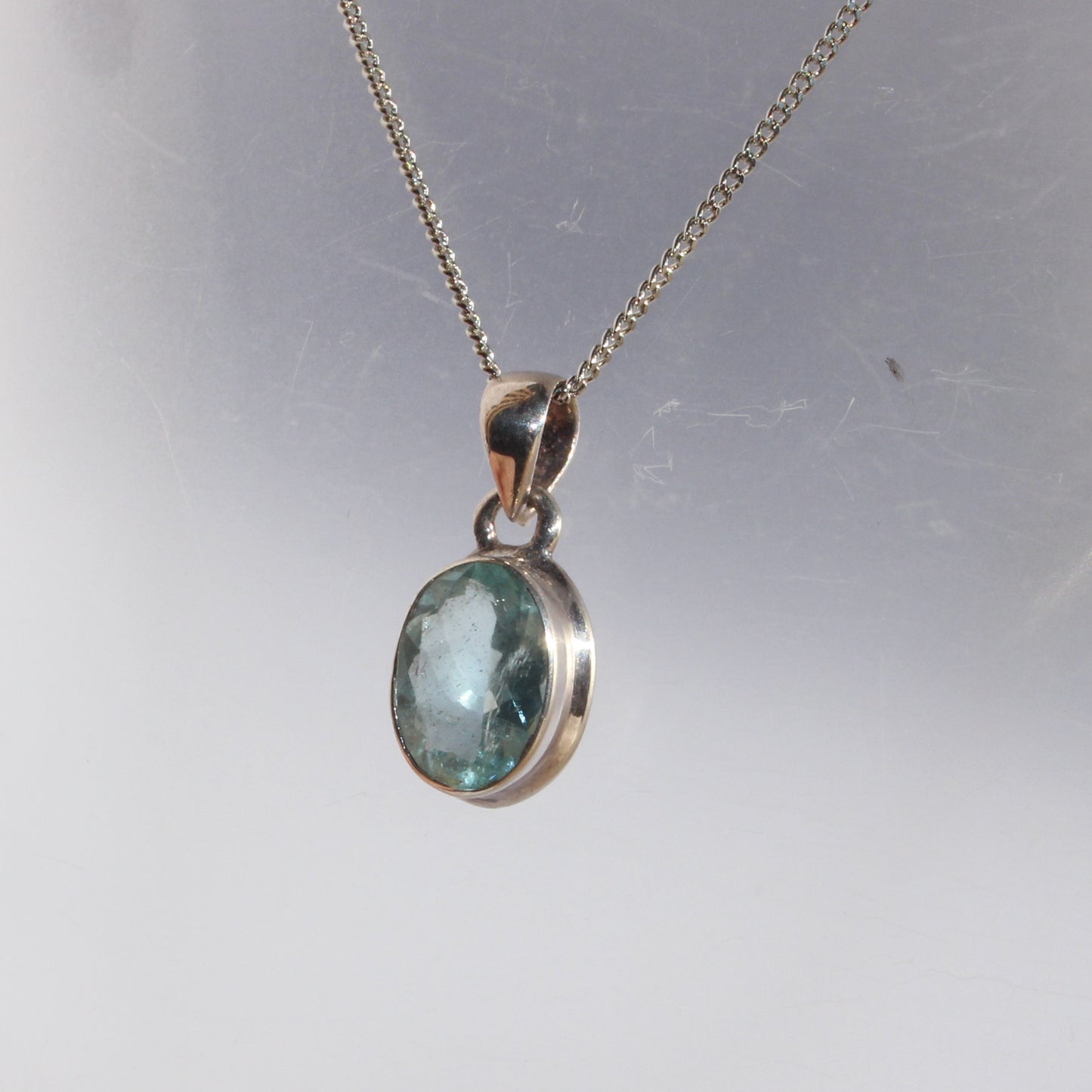 Aqua marine faceted pendant set in sterling silver