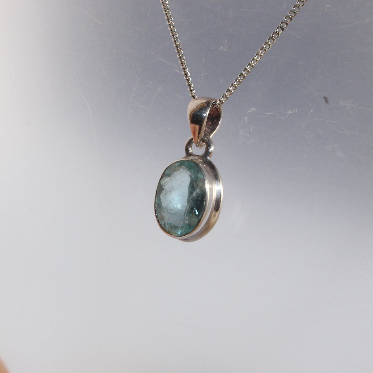 Aqua marine faceted pendant set in sterling silver
