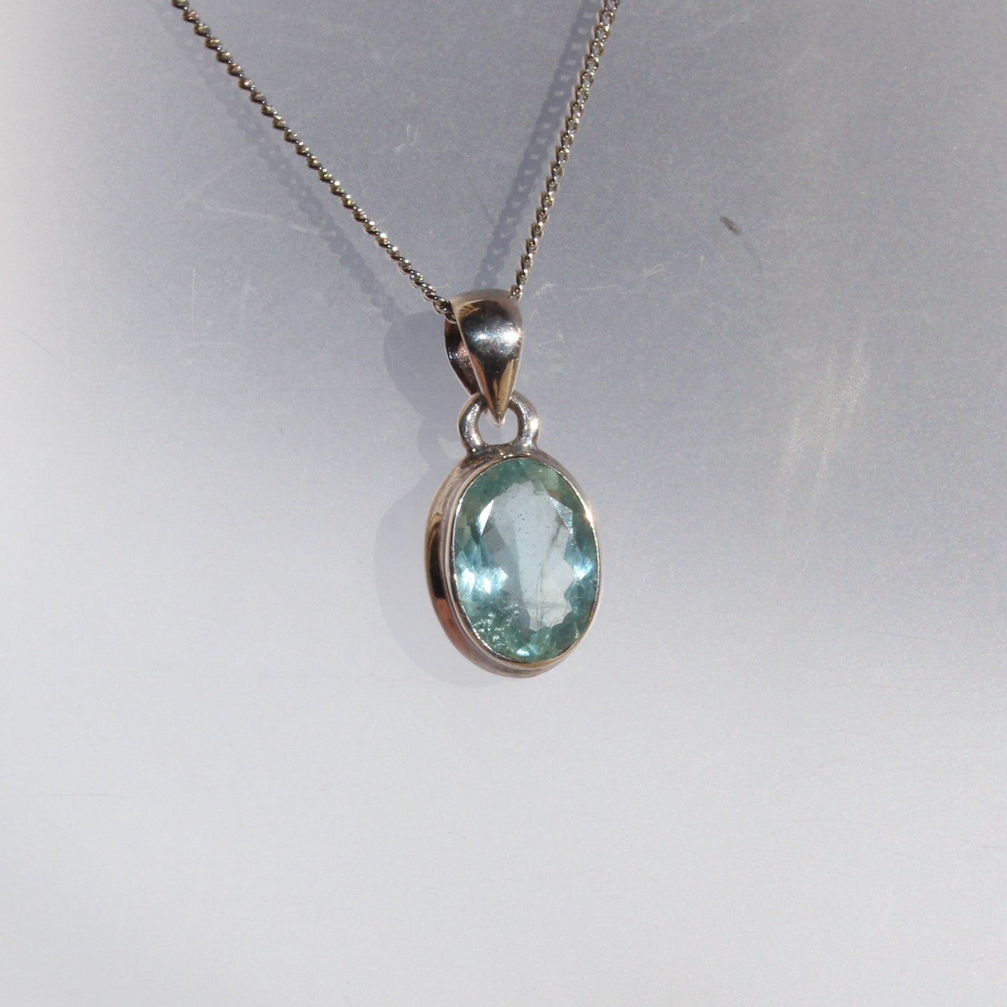 Aqua marine faceted pendant set in sterling silver