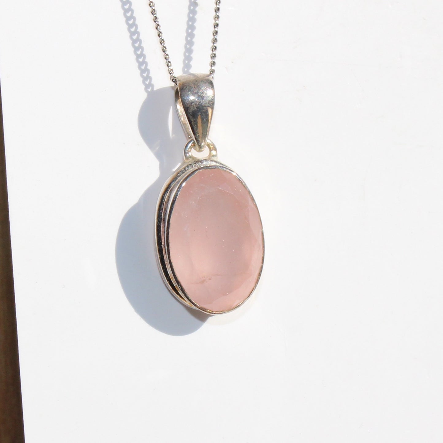 Rose quartz pendant sterling silver oval faceted silver