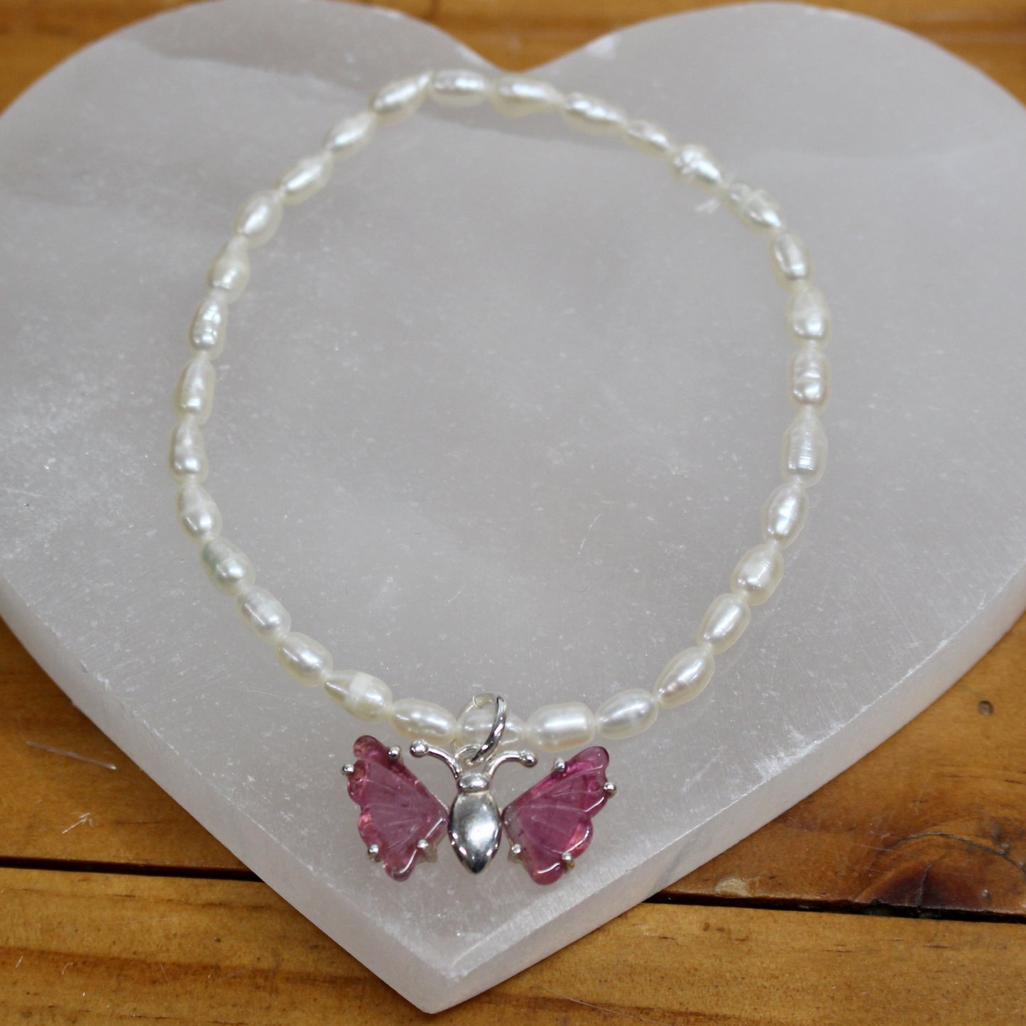 Seed pearl bracelet with pink tourmaline butterfly set in sterling silver