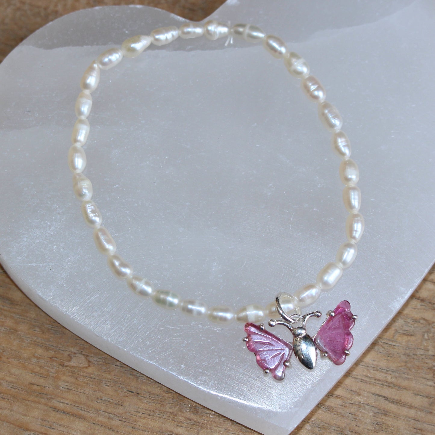 Seed pearl bracelet with pink tourmaline butterfly set in sterling silver