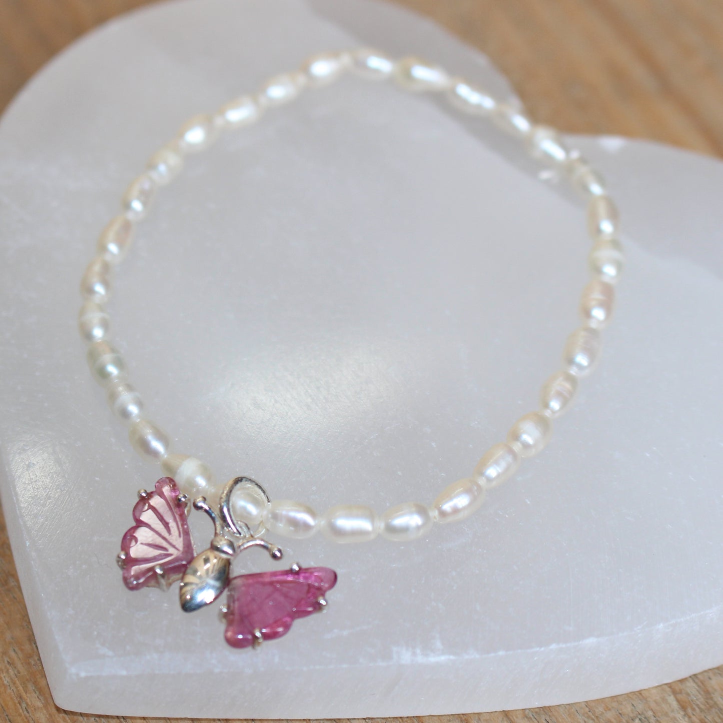 Seed pearl bracelet with pink tourmaline butterfly set in sterling silver