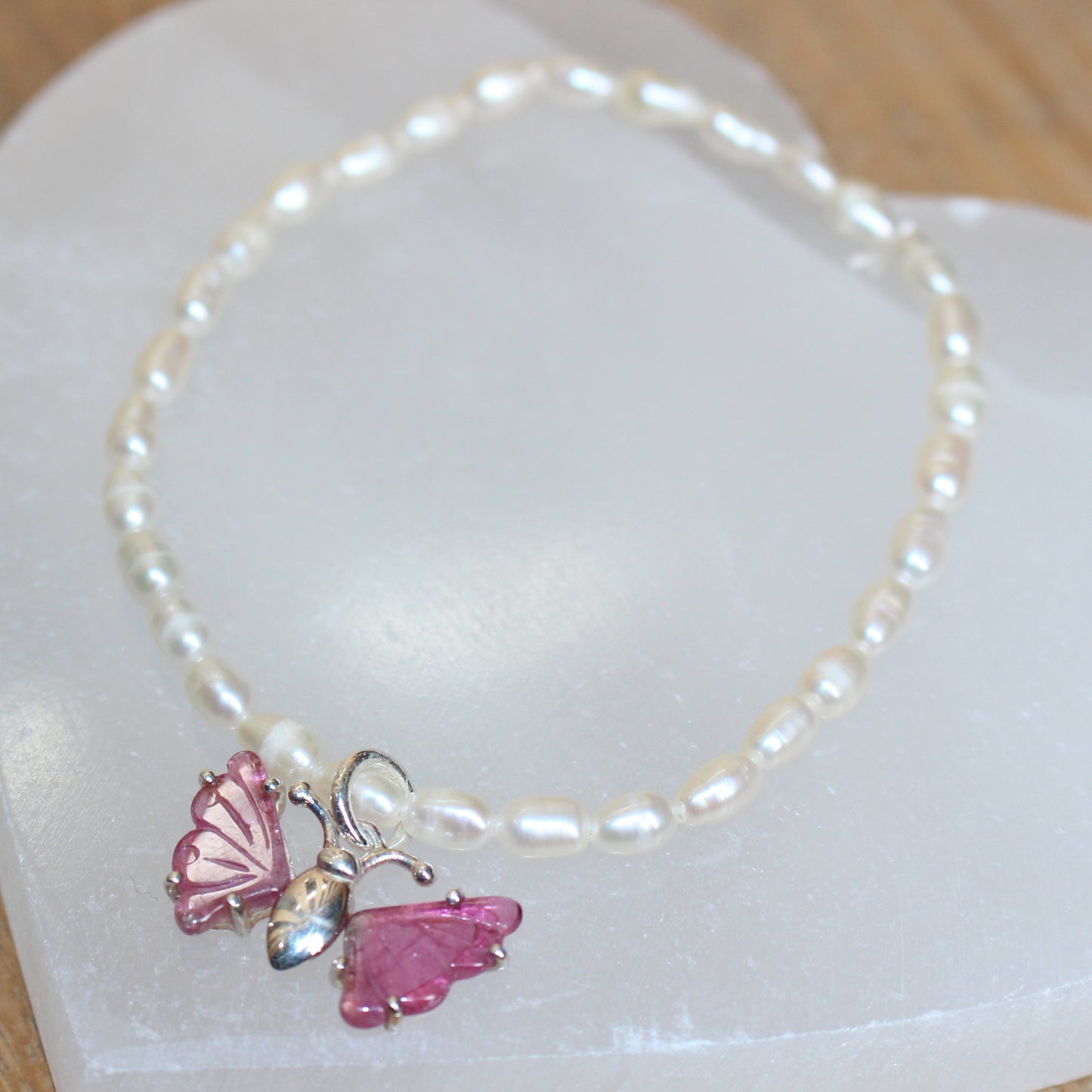 Seed pearl bracelet with pink tourmaline butterfly set in sterling silver