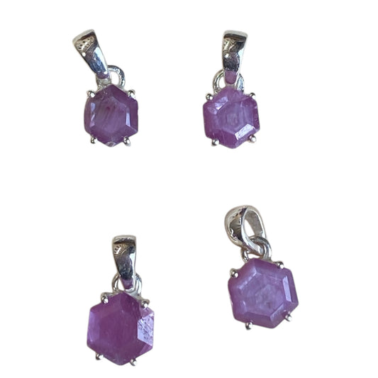 Ruby star sterling silver pendants in claw and bezel settings