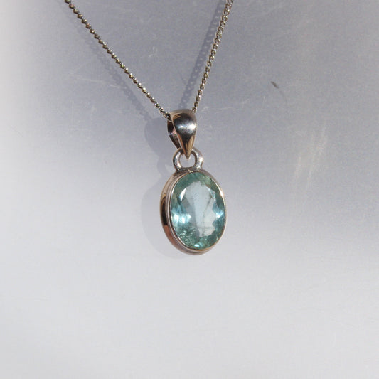 Aqua marine faceted pendant set in sterling silver